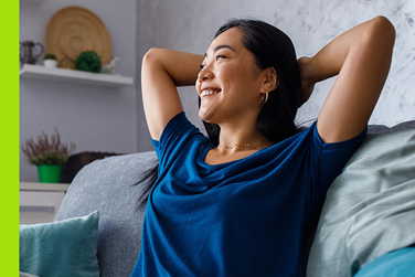 Smiling homeowner with a bright blue shirt
