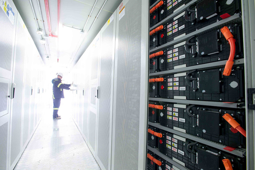 technician working on a battery storage unit