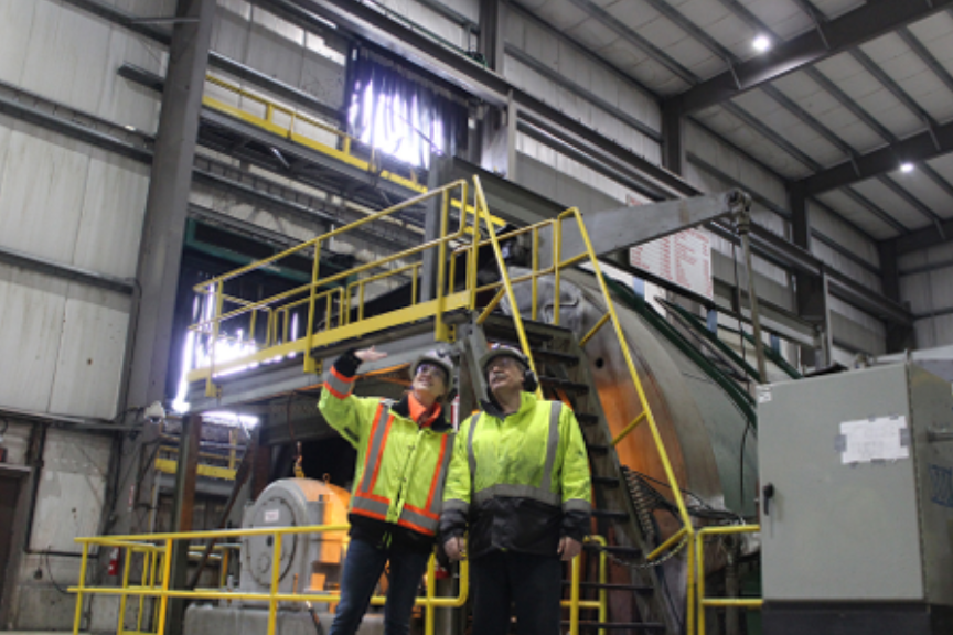Two workers in a industrial facility