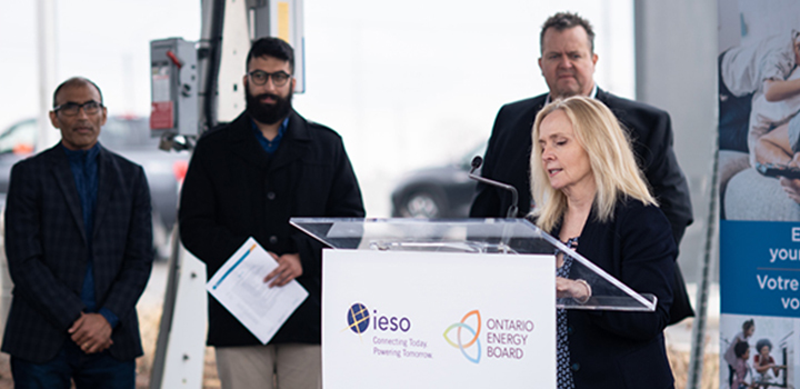IESO President and CEO Lesley Gallinger announcing EV Everywhere’s project funding for the EV at a media event at Hydro Ottawa’s headquarters on April 14, 2022. In the back from left to right is Devashish Paul, CEO and Founder of BluWave-ai, Gurmesh Sidhu Co-Founder and Chief Product Officer at Moment Energy, and Bryce Conrad President and CEO of Hydro Ottawa.